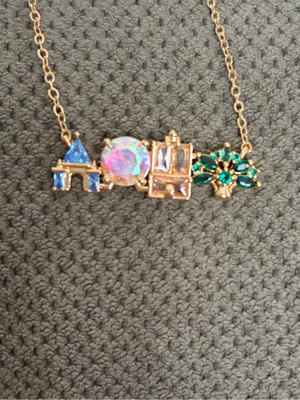 Beautiful necklace symbolizing four Disney World park icons